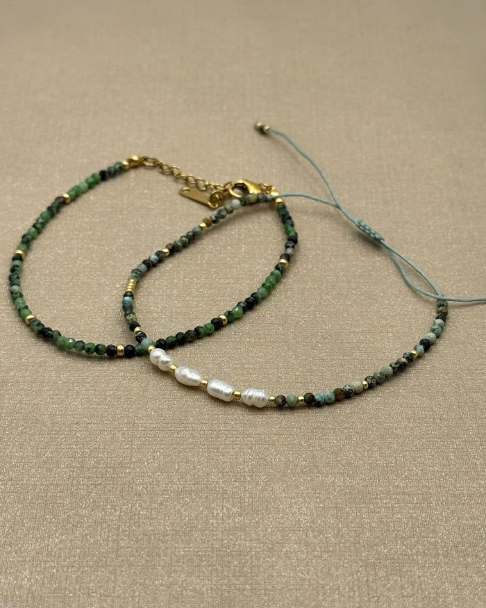 Flat lay of Amina African Turquoise bracelets