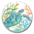 Round coaster with a turtle design surrounded by fish and coral on a white background