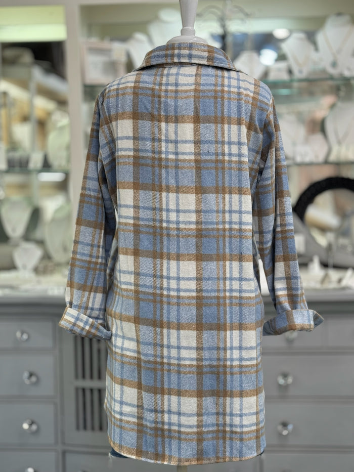 Back of women’s blue and camel plaid shacket, cozy button-up jacket.