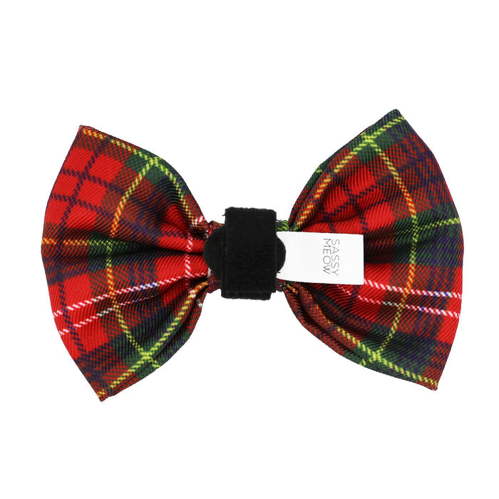 The Cat Bowtie - Deck the Paws by Sassy Woof features a red tartan plaid with green, yellow, white stripes, a black center band, and a visible Sassy Woof tag—ideal for festive holiday outfits or matching your cat’s red plaid collar.
