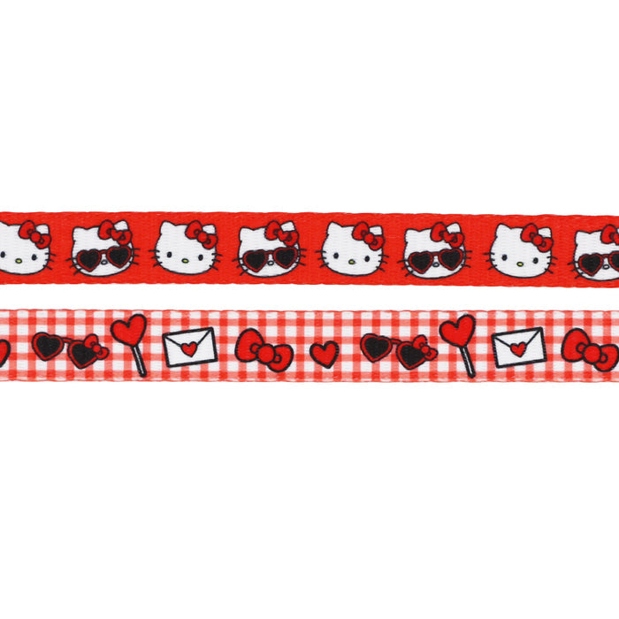 Two red and white Sassy Woof leashes: the Cat Leash - Hello Kitty® Red Classic with repeating cat faces, bows, and sunglasses; another featuring hearts, bows, and envelopes on a red gingham background.