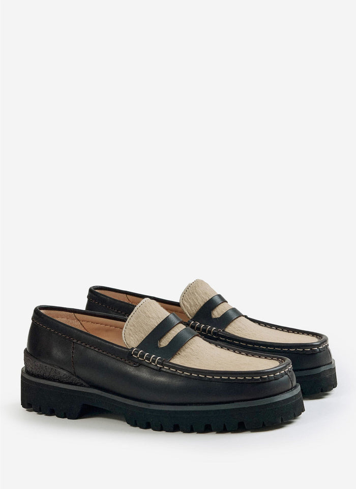 A pair of brown leather Yukoner Penny Loafers by Clarks Originals with maple hair-on vamps, stocked at Percival.
