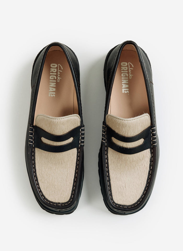 A top-down view of the brown Clarks Originals Yukoner Penny Loafers with a maple hair-on vamp from Percival.