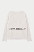 Crochet long sleeved white t-shirt with branding, against a white background.