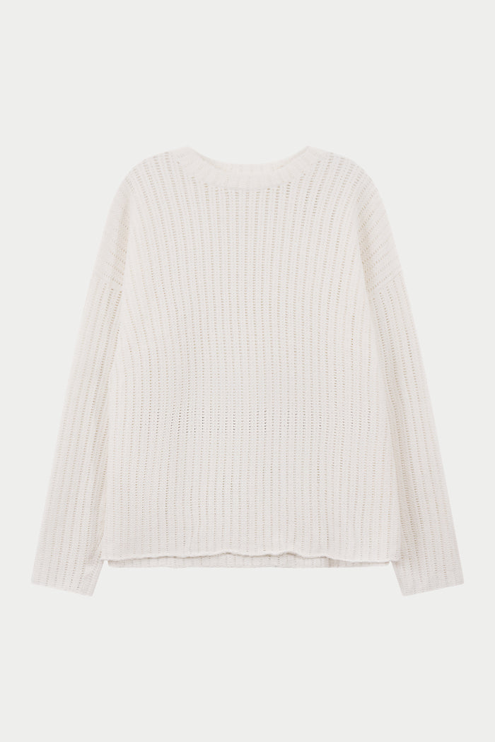 White crochet knitted long sleeve t-shirt on a light background