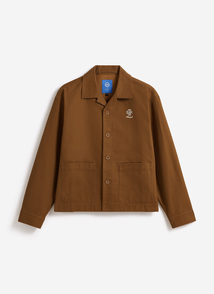 The Percival x Brighton & Hove Albion F.C. Cotton Canvas Workshirt in brown, showing front pockets and chest embroidery.