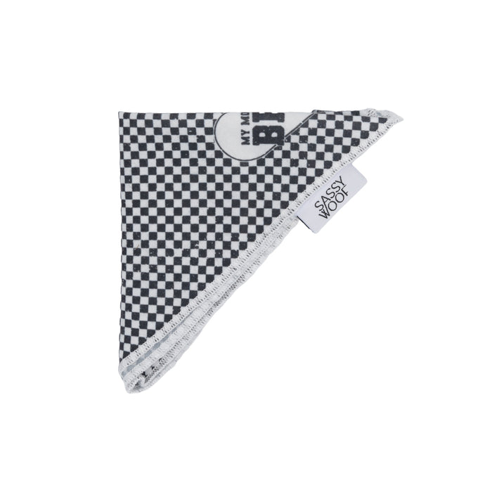 The Dog Bandana - My Mom is my BFF by Sassy Woof is folded into a triangle with the Sassy Woof tag showing. Pair it with an adjustable harness for matching, stylish dog accessories. The background is white.