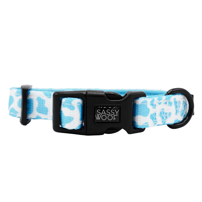 The Dog Collar - Blueberry Milk by Sassy Woof features a blue and white patterned neoprene design, a black plastic buckle with the Sassy Woof logo, and a metal ring.