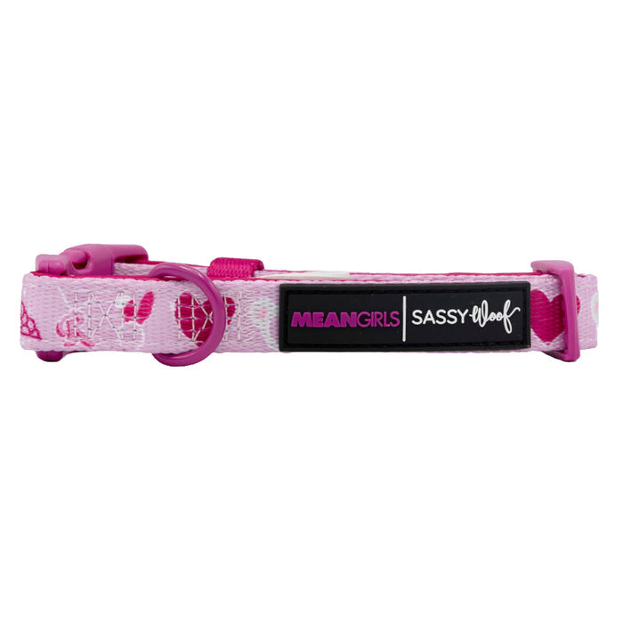 The Dog Collar - Mean Girls™ by Sassy Woof features a pink buckle, D-ring, and iconic lips and high heels designs. It includes a Sassy Woof logo patch and is part of the Puppy Growth Pawtection Plan.