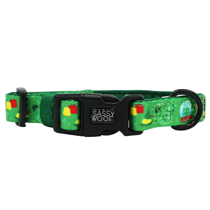 A green adjustable dog collar from the Sassy Woof Dog Collar Three Piece Bundle - Elf™, featuring colorful apple and caterpillar designs and a black plastic buckle.