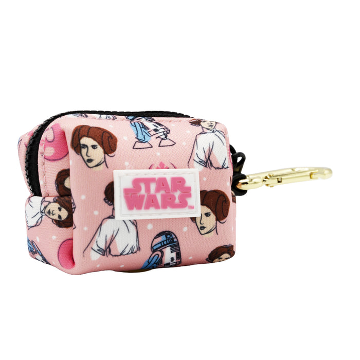 The Sassy Woof Dog Waste Bag Holder - STAR WARS™ Princess Leia is a small pink pouch with cartoon Leia and R2-D2 designs, a gold clip for easy attachment, and is perfect for carrying dog waste bags.