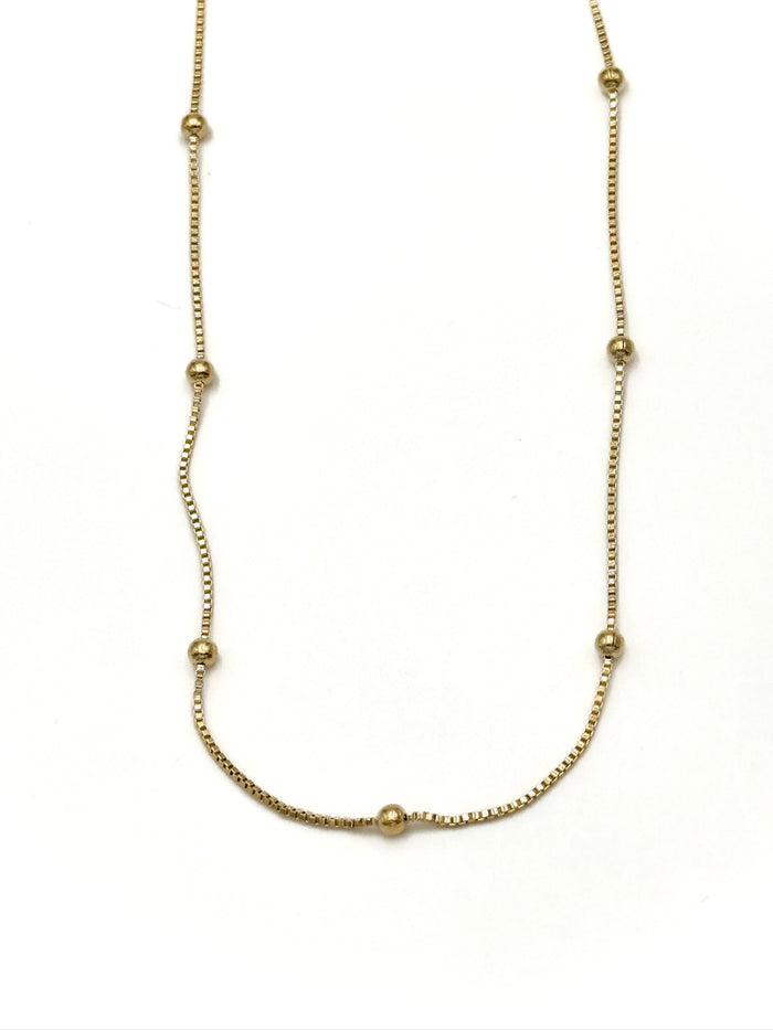 Gold necklace on a white background