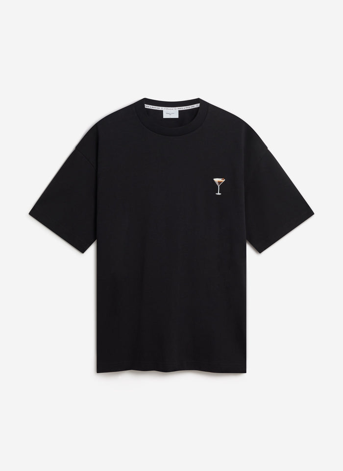 A flat lay of the Percival Espresso Martini Oversized T-Shirt in black, showing the cocktail embroidery on the chest.