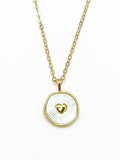 Necklace with a gold chain and pendant featuring a gold heart design on a white background