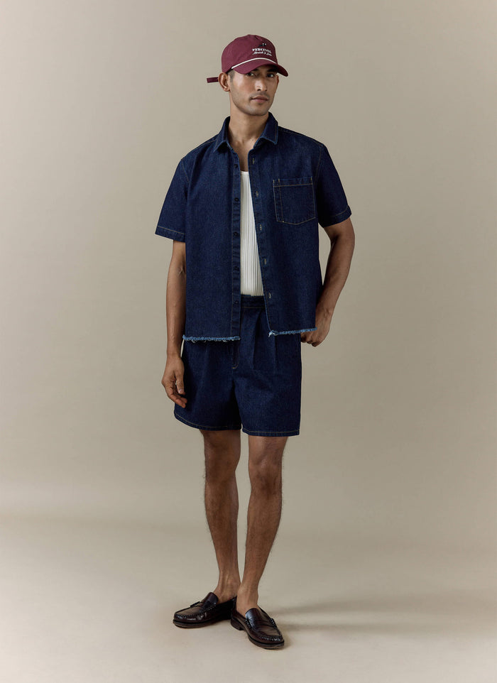 Percival dark indigo Harley denim cropped shirt paired with matching Blake double pleated shorts.