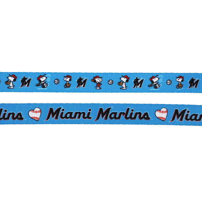 Show off your MLB™ x Peanuts™ Miami Marlins™ pride with the Sassy Woof Harness Three Piece Bundle, featuring Snoopy in a baseball cap, baseballs, Miami Marlins logos, and "I ♥ Miami Marlins" text—perfect for fans!.