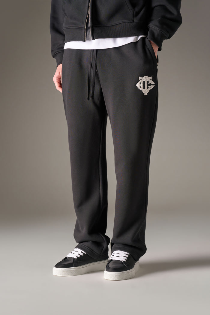 HEAVYWEIGHT MONOGRAM APPLIQUE EMBLEM JOGGERS - BLACK