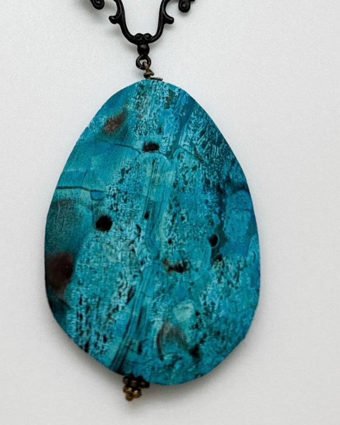 Close-up of Ocean Jasper stone pendant on handcrafted brass chain by Nina Halls