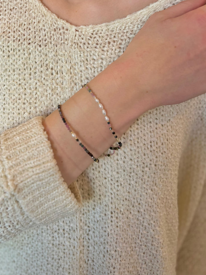 Lila Tourmaline & Freshwater Pearl Bracelet shown on model wrist stacked with other tourmaline bracelet