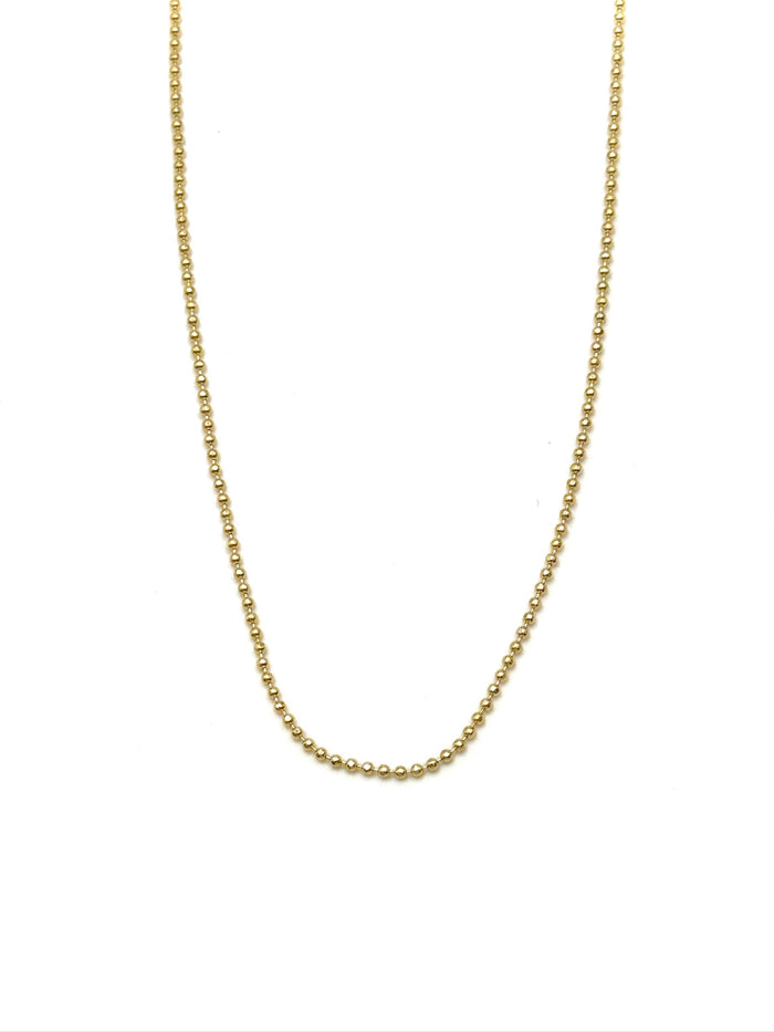 Gold chain necklace on a white background