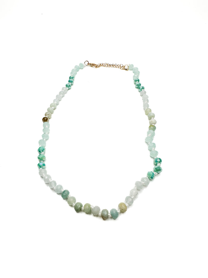 Necklace with multicolored beads on a white background
