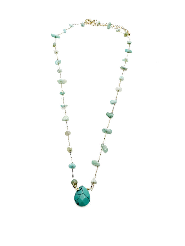 gold-toned necklace with scattered green and turquoise gemstone chips and a large central turquoise teardrop pendant