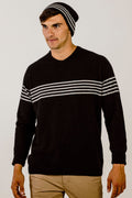 A person wearing a black beanie with grey stripes, standing against a white background.