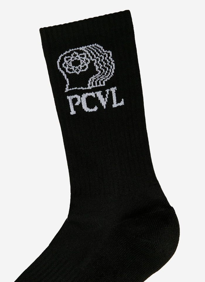 A close-up of the white jacquard PCVL graphic on the ribbed cuff of the black sport socks from Percival.