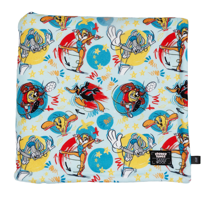 The Sassy Woof Pet Blanket - Looney Tunes™ Blue features vibrant images of Bugs Bunny, Tweety Bird, and Sylvester on a light blue background with stars and swirling patterns.