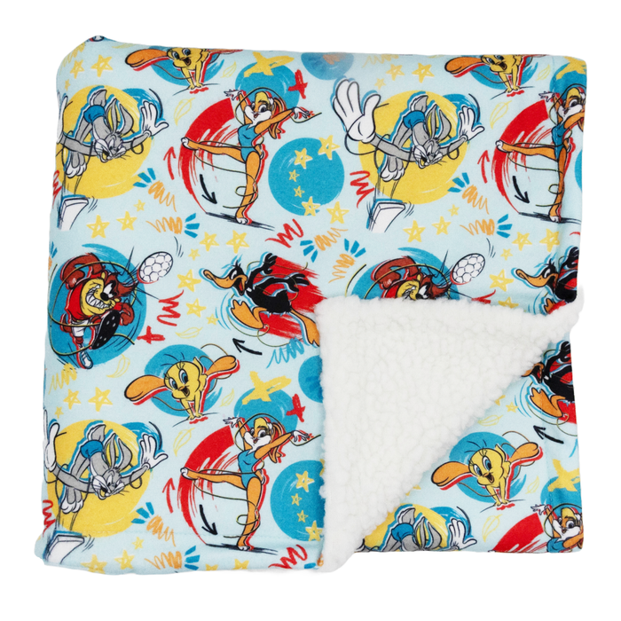The Sassy Woof Pet Blanket - Looney Tunes™ Blue features vibrant cartoon characters, adding playful charm and coziness to any room.