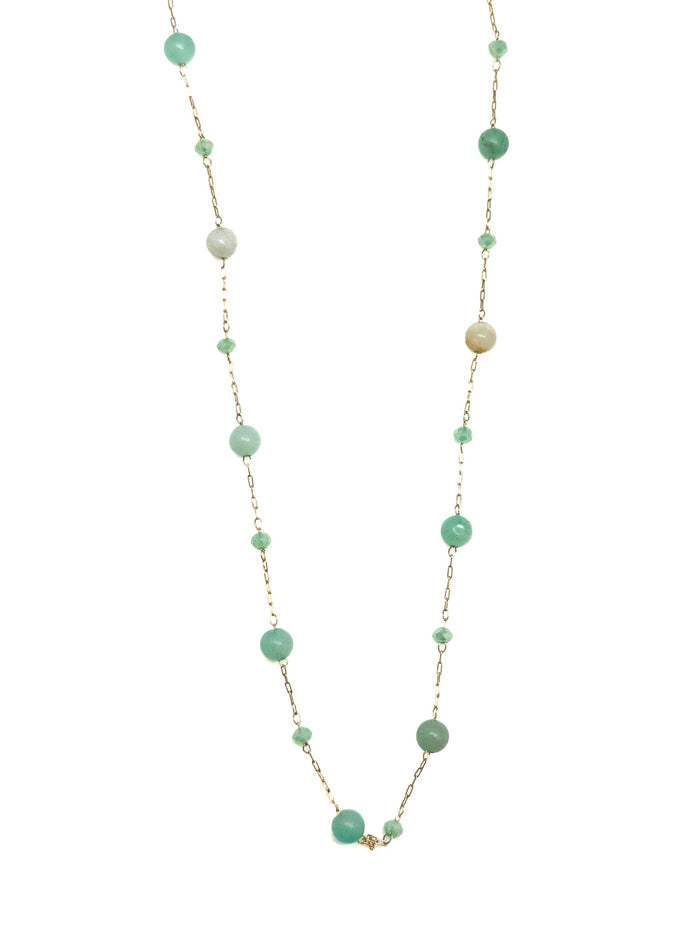 Delicate gold chain necklace with scattered light green, mint, and sea-glass toned beads, displayed on white background.