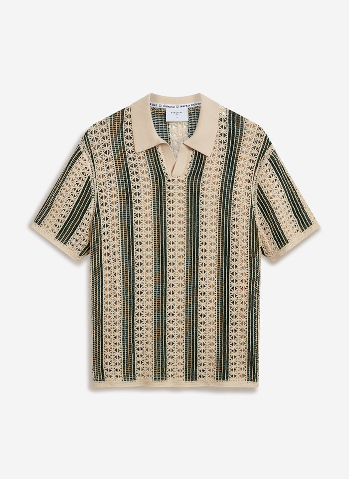 The Percival Sarti Knitted Polo Shirt in ecru and forest green, laid flat to display its intricate crochet striped pattern.