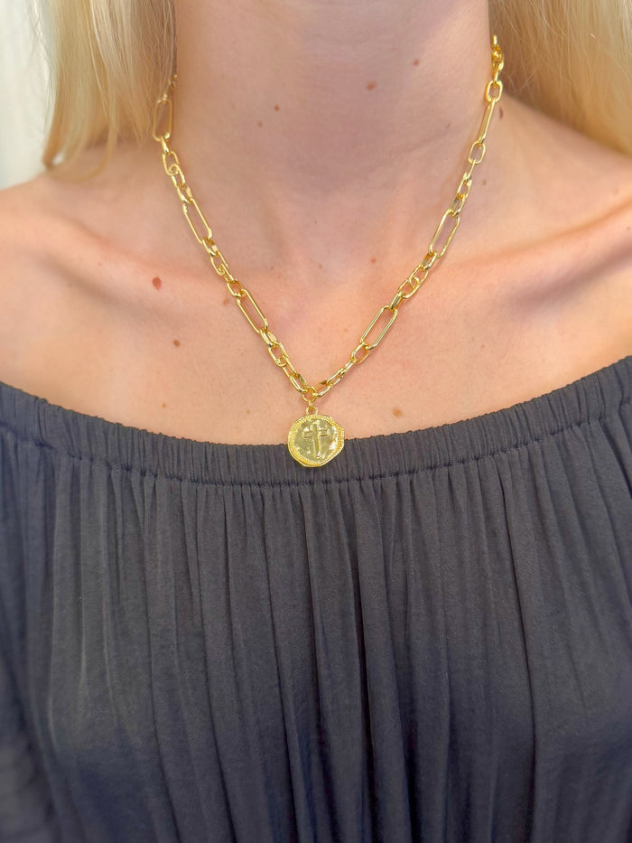 Sophia Gold  Medallion Cross Necklace with gold link chain on woman's neck