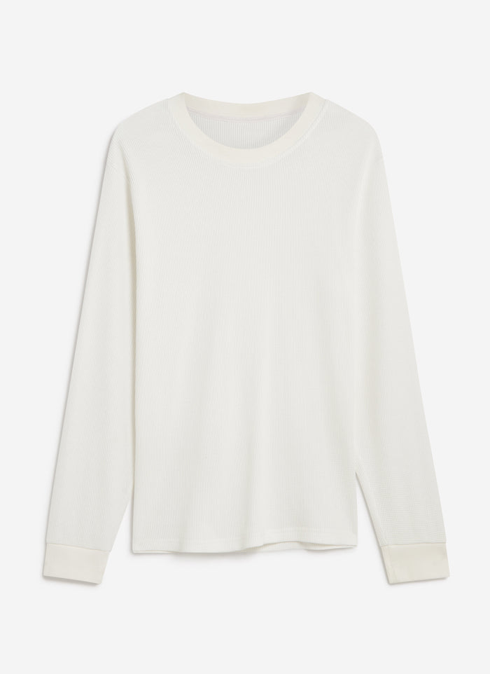 A flat lay of the Percival Waffle Long Sleeve T Shirt in white, showing its textured organic cotton waffle knit.