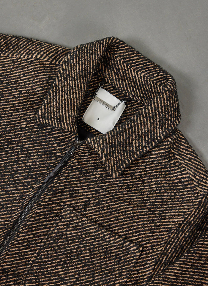close up of the percival zip overshirt in oak and black twill, showing the diagonal pattern and branded collar.