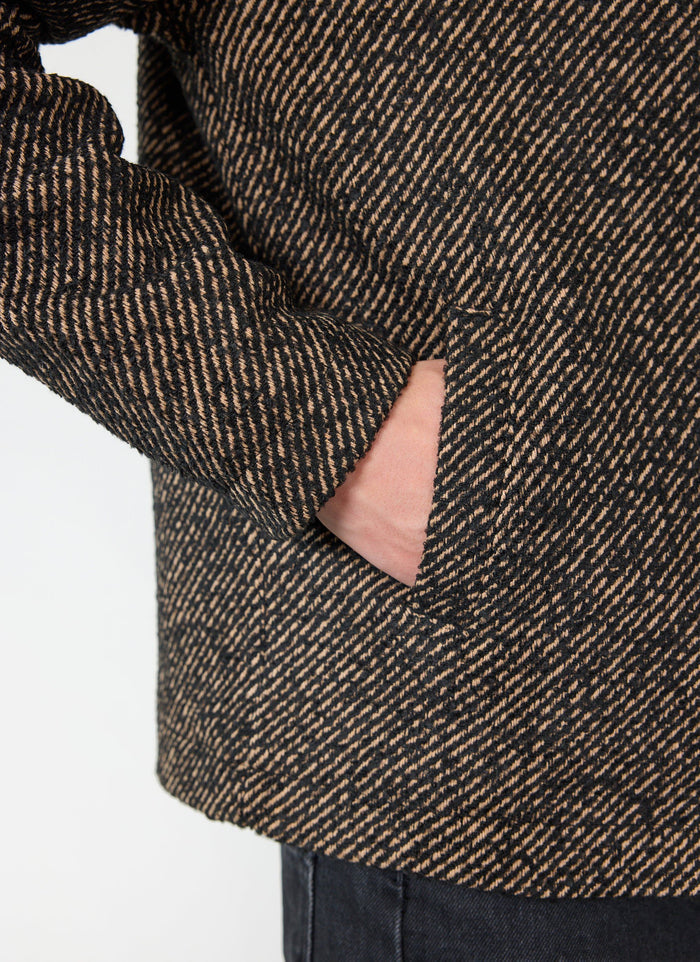 Close up of the percival Zip Overshirt in Oak twill, showing the textured fabric and side pocket detail.